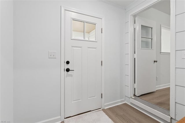 13067 Poor House Rd, Windsor, VA 23487 - foyer featuring wood finished floors and crown molding