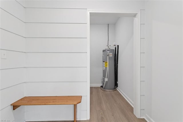 13067 Poor House Rd, Windsor, VA 23487 - below grade area featuring water heater and light wood-type flooring