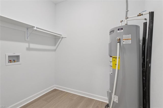 13067 Poor House Rd, Windsor, VA 23487 - washroom with water heater, wood finished floors, and hookup for a washing machine