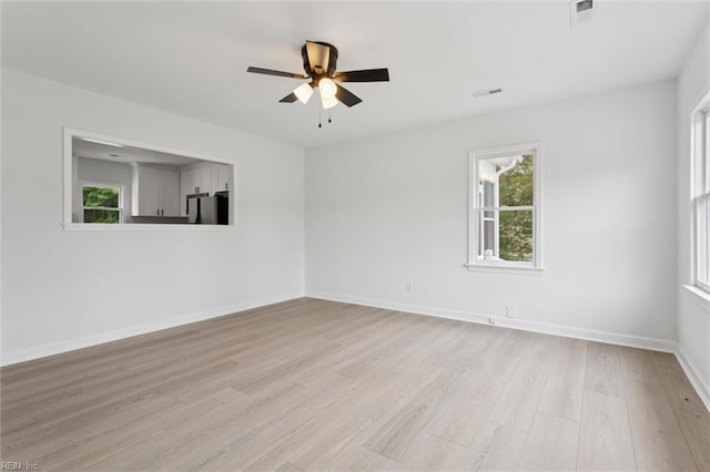 13067 Poor House Rd, Windsor, VA 23487 - spare room with healthy amount of natural light, ceiling fan, and light wood-style flooring