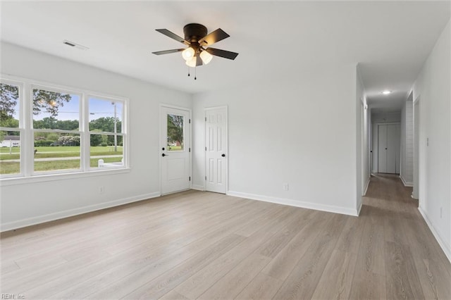 13067 Poor House Rd, Windsor, VA 23487 - empty room with light wood finished floors and a ceiling fan
