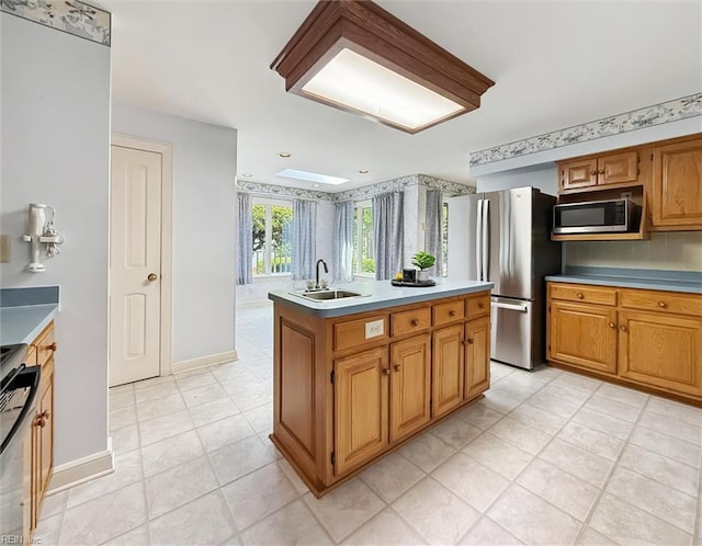 133 Randolphs Grn, Williamsburg, VA 23185 - kitchen with stainless steel appliances, an island with sink, light countertops, and light tile patterned flooring