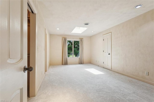 133 Randolphs Grn, Williamsburg, VA 23185 - spare room with a skylight, light carpet, and recessed lighting