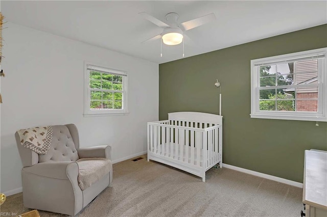 845 Cascade Dr, Newport News, VA 23608 - carpeted bedroom featuring a crib and a ceiling fan