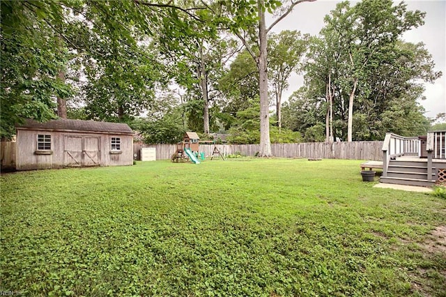 845 Cascade Dr, Newport News, VA 23608 - fenced backyard with a storage unit, a playground, and a deck