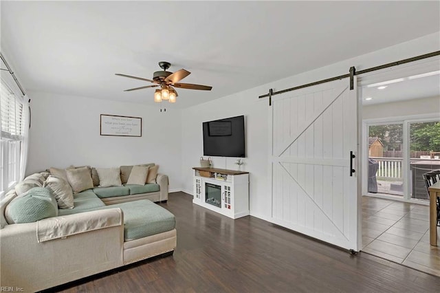 845 Cascade Dr, Newport News, VA 23608 - living room featuring a barn door, a ceiling fan, and wood finished floors