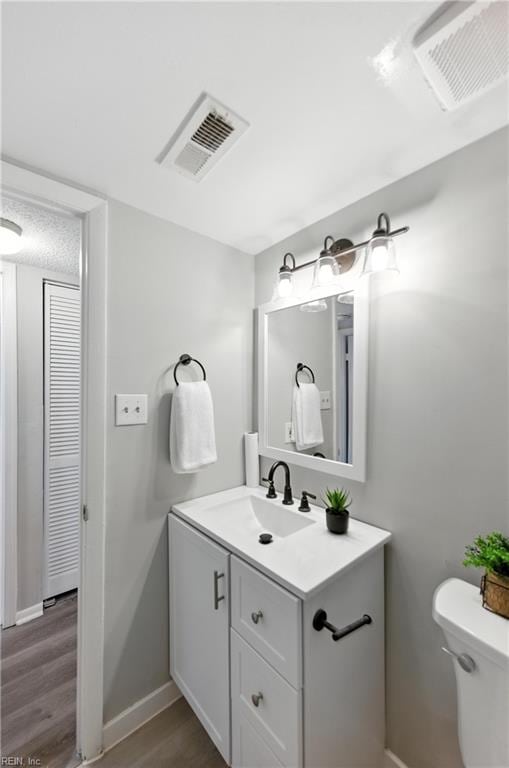 628 Crows Nest Ct Unit 101, Virginia Beach, VA 23462 - bathroom featuring vanity and wood finished floors