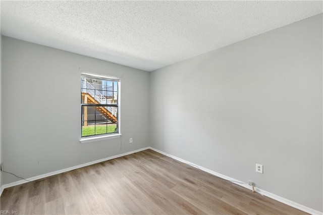 628 Crows Nest Ct Unit 101, Virginia Beach, VA 23462 - unfurnished room with wood finished floors and a textured ceiling