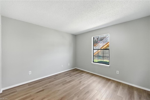 628 Crows Nest Ct Unit 101, Virginia Beach, VA 23462 - unfurnished room with wood finished floors and a textured ceiling