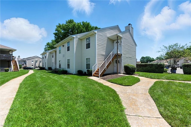 628 Crows Nest Ct Unit 101, Virginia Beach, VA 23462 - view of front of property featuring stairs, a chimney, a front lawn, and a residential view