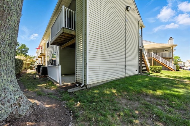 628 Crows Nest Ct Unit 101, Virginia Beach, VA 23462 - view of side of home featuring stairs and a lawn