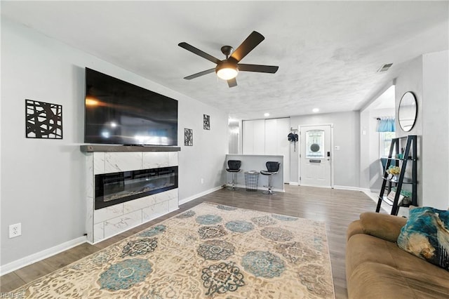 22 Greenwell Dr, Hampton, VA 23666 - living area featuring a ceiling fan, wood finished floors, and a tiled fireplace