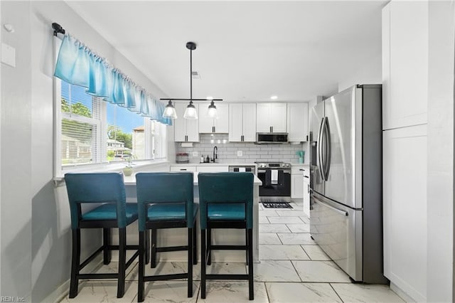 22 Greenwell Dr, Hampton, VA 23666 - kitchen featuring stainless steel appliances, light marble finish flooring, white cabinets, light countertops, and a peninsula