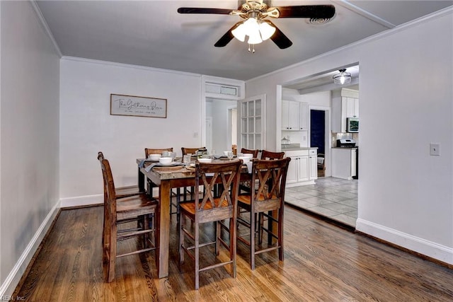 826 Lee St, West Point, VA 23181 - dining space with a ceiling fan, crown molding, and wood finished floors