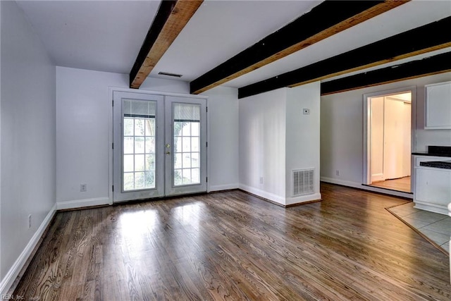 826 Lee St, West Point, VA 23181 - unfurnished living room featuring french doors, wood finished floors, and beam ceiling
