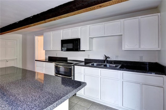 826 Lee St, West Point, VA 23181 - kitchen with black microwave, stainless steel range with electric cooktop, beamed ceiling, dark countertops, and white cabinetry