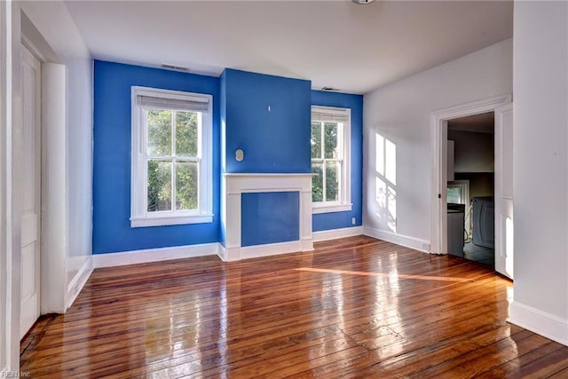 826 Lee St, West Point, VA 23181 - unfurnished living room featuring plenty of natural light, wood-type flooring, and a fireplace