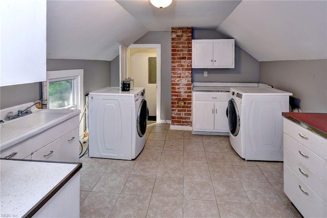 826 Lee St, West Point, VA 23181 - laundry area with independent washer and dryer, light tile patterned floors, and cabinet space