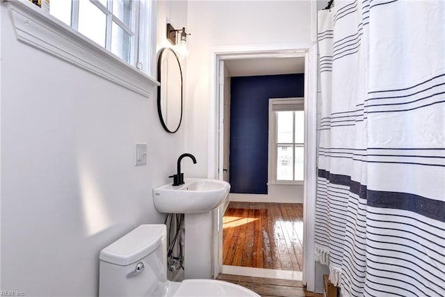 826 Lee St, West Point, VA 23181 - full bathroom featuring wood-type flooring and a shower with shower curtain