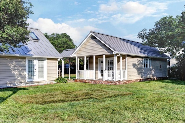 826 Lee St, West Point, VA 23181 - view of front facade with covered porch, a front lawn, a metal roof, and a standing seam roof