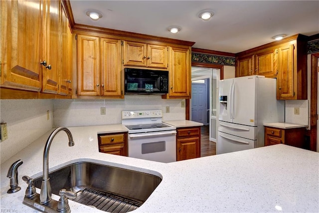 308 Royal Grant Dr, Williamsburg, VA 23185 - kitchen featuring white appliances, brown cabinets, backsplash, light stone counters, and recessed lighting