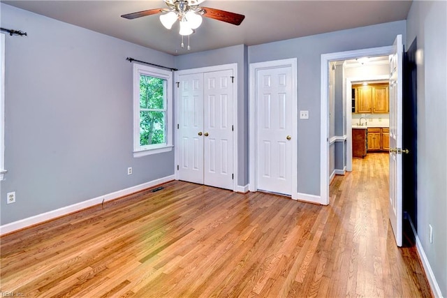 308 Royal Grant Dr, Williamsburg, VA 23185 - unfurnished bedroom featuring light wood-type flooring, a closet, and a ceiling fan
