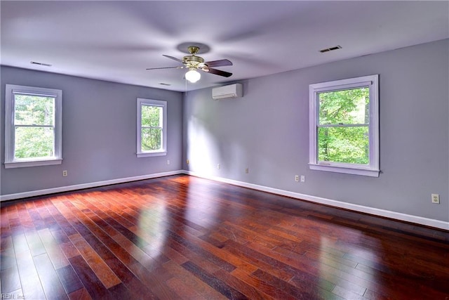 308 Royal Grant Dr, Williamsburg, VA 23185 - unfurnished room with an AC wall unit, hardwood / wood-style flooring, and a ceiling fan