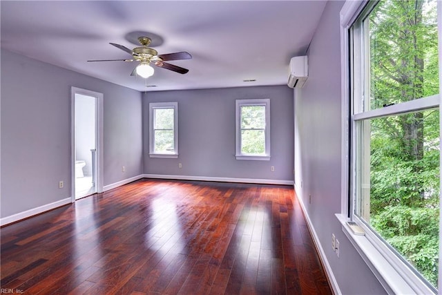 308 Royal Grant Dr, Williamsburg, VA 23185 - unfurnished room featuring an AC wall unit, hardwood / wood-style floors, and a ceiling fan