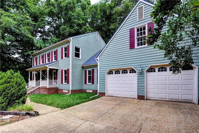 308 Royal Grant Dr, Williamsburg, VA 23185 - colonial home with concrete driveway, an attached garage, and crawl space