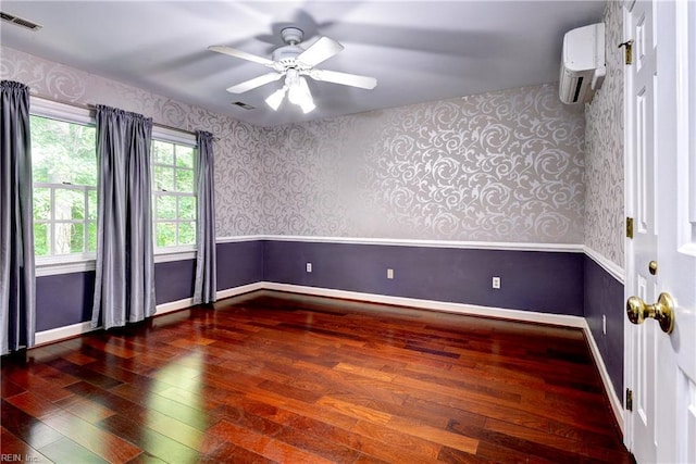 308 Royal Grant Dr, Williamsburg, VA 23185 - empty room featuring wood-type flooring, wallpapered walls, a wall mounted AC, ceiling fan, and a wainscoted wall