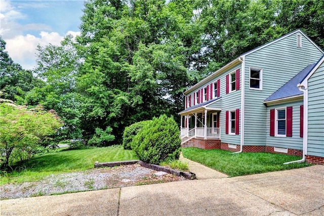 308 Royal Grant Dr, Williamsburg, VA 23185 - view of property exterior with a yard and a porch