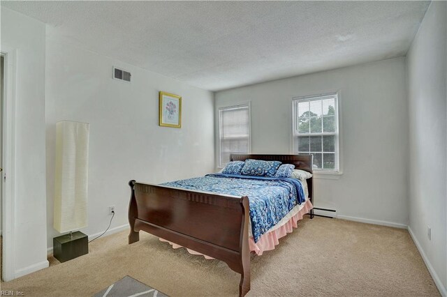 713 Bishop Dr, Virginia Beach, VA 23455 - bedroom with carpet floors, a textured ceiling, and a baseboard radiator
