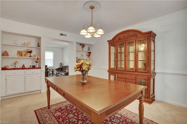 713 Bishop Dr, Virginia Beach, VA 23455 - dining room with a chandelier and light carpet