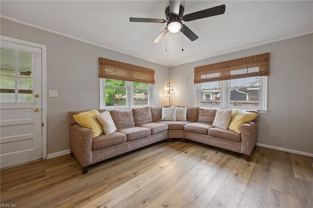 2440 Sir Lance Dr, Chesapeake, VA 23325 - living room featuring light wood-type flooring, a ceiling fan, and ornamental molding