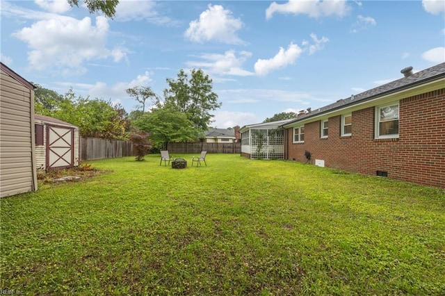 2440 Sir Lance Dr, Chesapeake, VA 23325 - fenced backyard with a fire pit and a shed