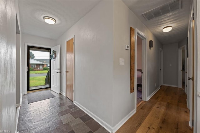 2440 Sir Lance Dr, Chesapeake, VA 23325 - entryway featuring baseboards and dark stone finish flooring