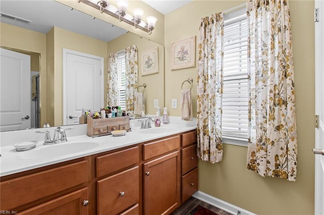 3468 Westham Ln, Toano, VA 23168 - full bathroom with double vanity and healthy amount of natural light