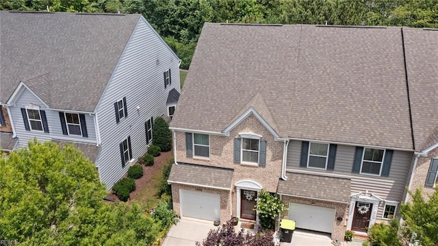 3468 Westham Ln, Toano, VA 23168 - view of front of house featuring brick siding, an attached garage, driveway, and a shingled roof