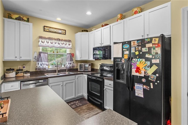3468 Westham Ln, Toano, VA 23168 - kitchen featuring black appliances, dark countertops, recessed lighting, white cabinetry, and dark wood-style flooring