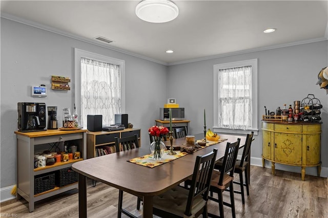1312 Duncan Ln, Virginia Beach, VA 23455 - dining space with crown molding, wood finished floors, healthy amount of natural light, and recessed lighting