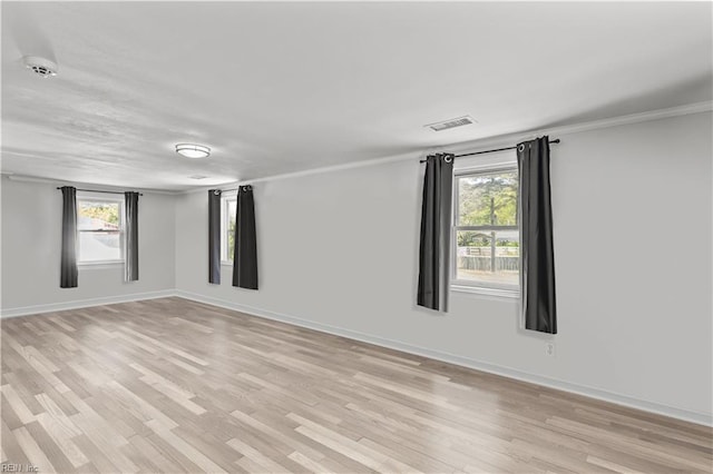 1312 Duncan Ln, Virginia Beach, VA 23455 - unfurnished room featuring light wood-style flooring, healthy amount of natural light, ornamental molding, and a smoke detector