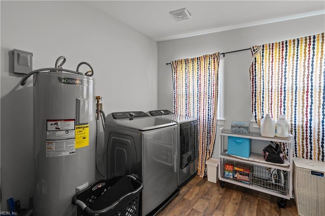 1312 Duncan Ln, Virginia Beach, VA 23455 - laundry area featuring water heater, washing machine and dryer, and dark wood-style floors