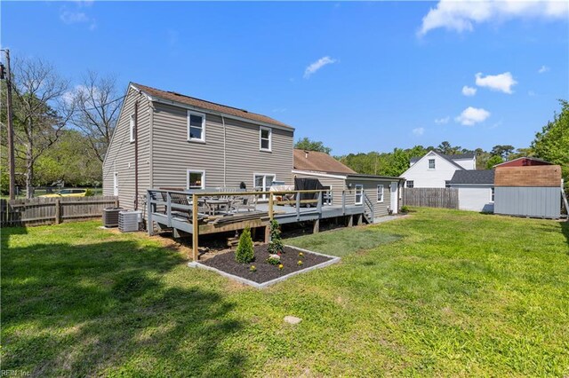 1312 Duncan Ln, Virginia Beach, VA 23455 - rear view of house with a storage shed, a fenced backyard, and a wooden deck