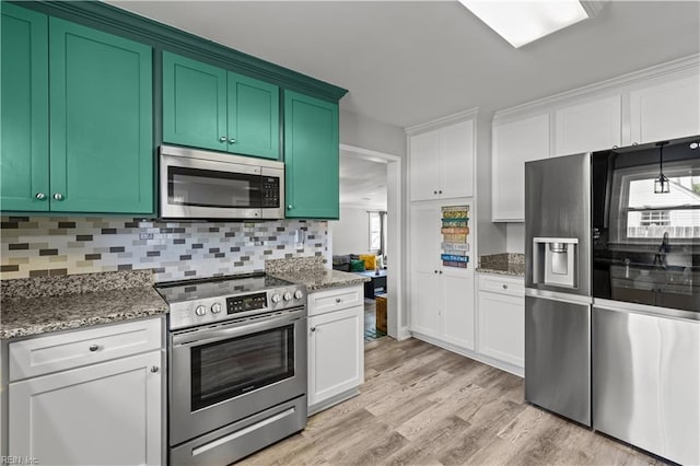 1312 Duncan Ln, Virginia Beach, VA 23455 - kitchen with appliances with stainless steel finishes, light wood-type flooring, backsplash, light stone counters, and white cabinets