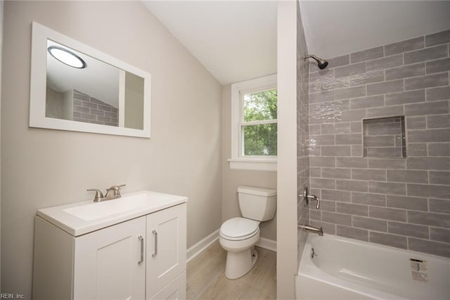 961 Hugo St, Norfolk, VA 23513 - full bathroom with vanity, wood finished floors, vaulted ceiling, and bathing tub / shower combination