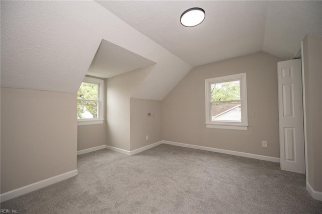 961 Hugo St, Norfolk, VA 23513 - bonus room with a textured ceiling, lofted ceiling, and carpet flooring
