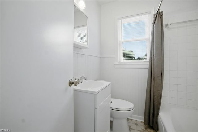 4400 Bart St, Portsmouth, VA 23707 - full bathroom featuring vanity, a wainscoted wall, shower / tub combo with curtain, and tile patterned floors