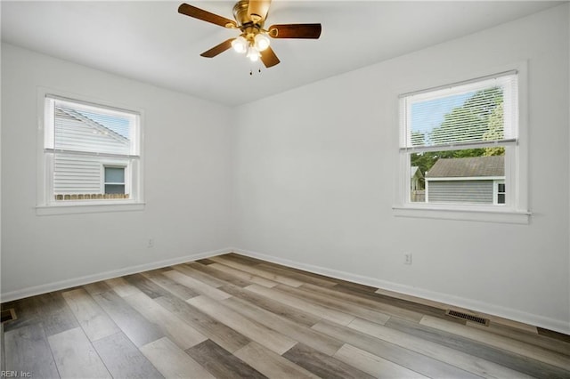 4400 Bart St, Portsmouth, VA 23707 - empty room with light wood-type flooring and ceiling fan