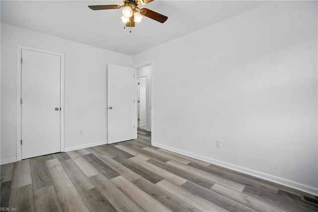 4400 Bart St, Portsmouth, VA 23707 - unfurnished bedroom featuring wood finished floors and ceiling fan