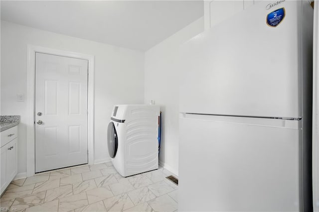 4400 Bart St, Portsmouth, VA 23707 - laundry area featuring washer / dryer and light marble finish flooring